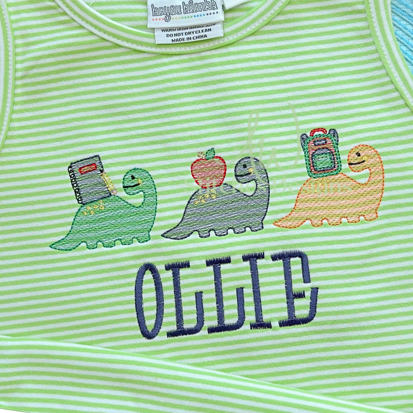 Complete view of Dinosaur Trio machine embroidery design.
