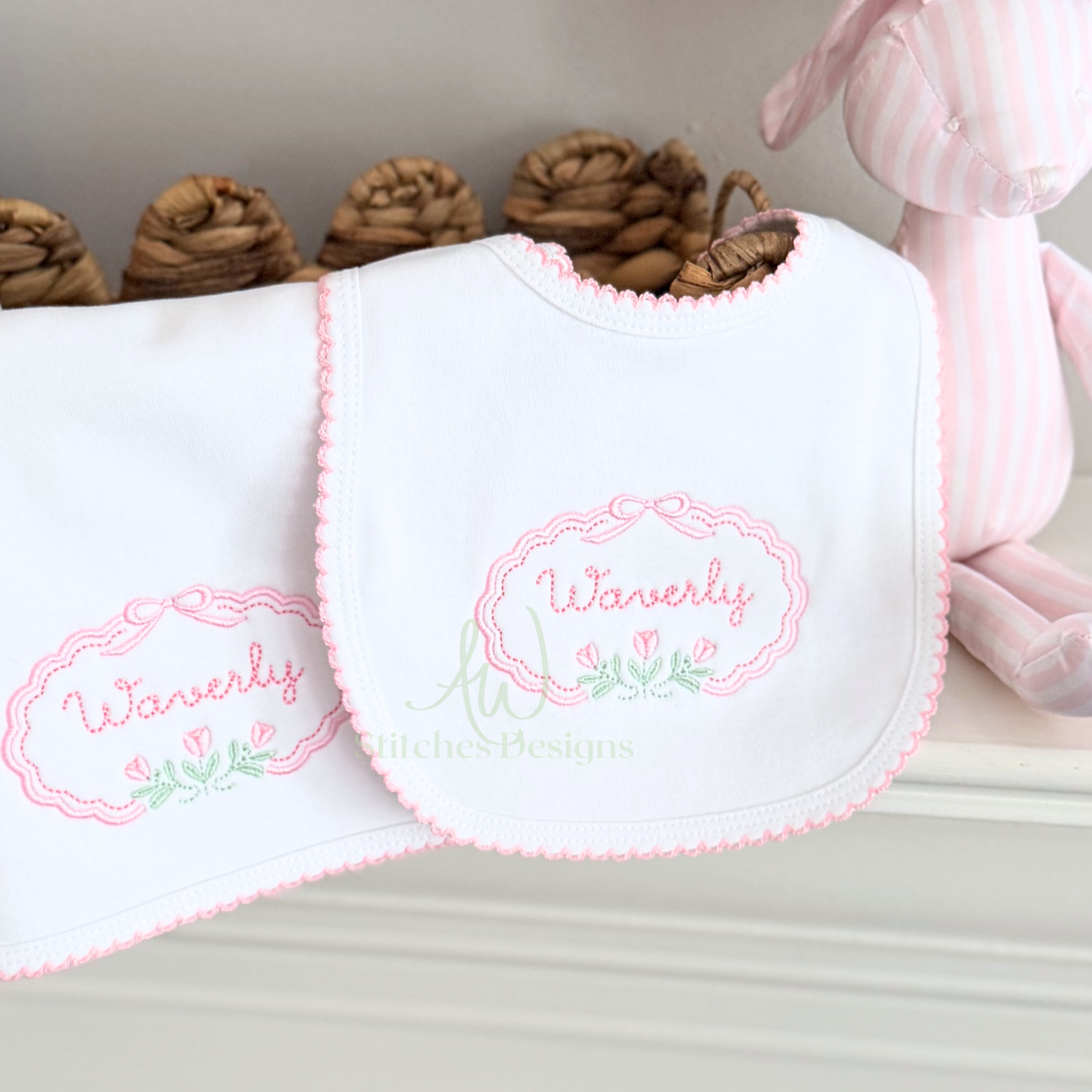 White bib with 'Waverly' embroidery on a neutral background