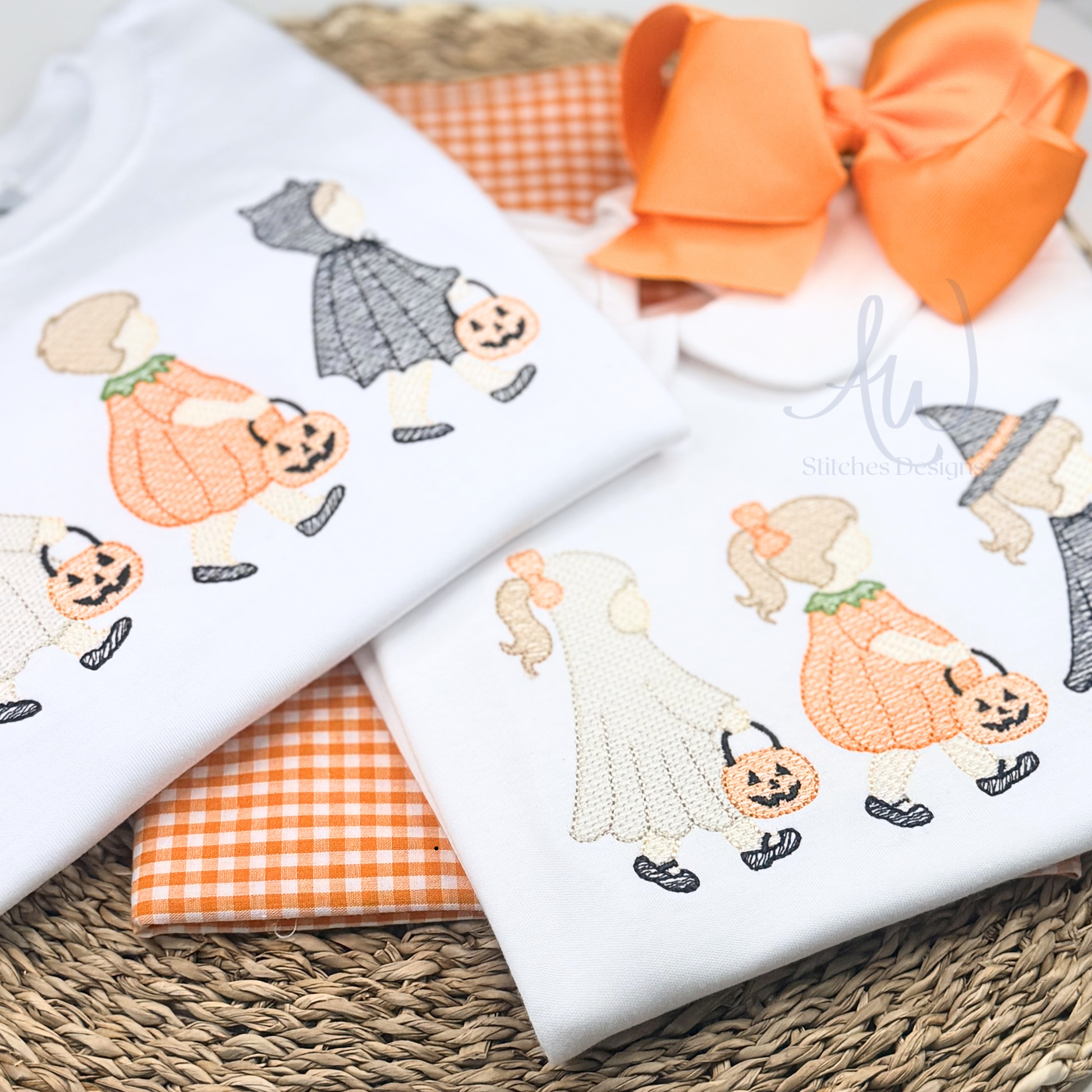 Two embroidered fabric panels with Halloween-themed designs on a woven surface.