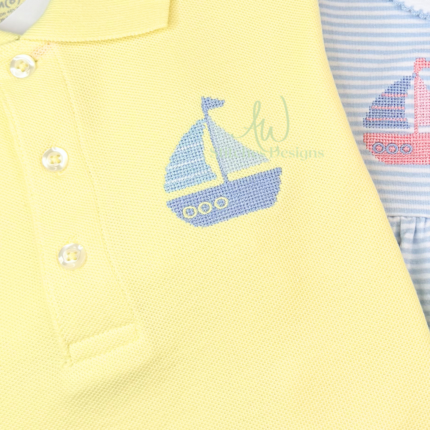 Yellow baby outfit with sailboat design and striped blue and pink garment.