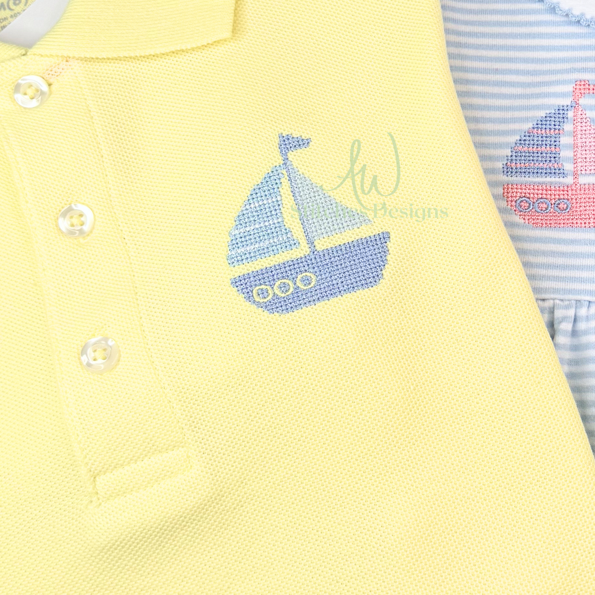 Yellow baby outfit with sailboat design and striped blue and pink garment.