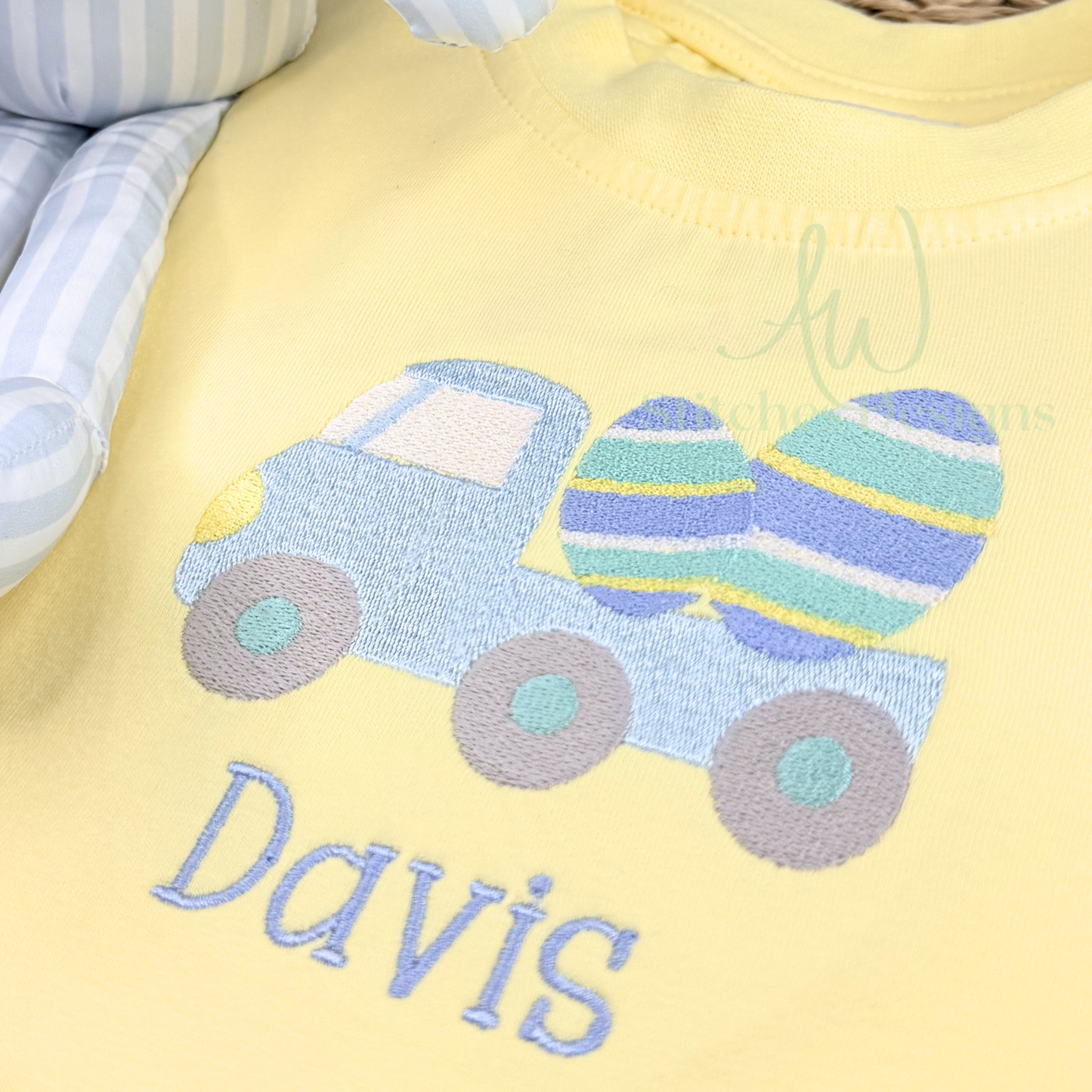 Yellow shirt with blue truck and striped egg design, featuring the name 'Davis'.