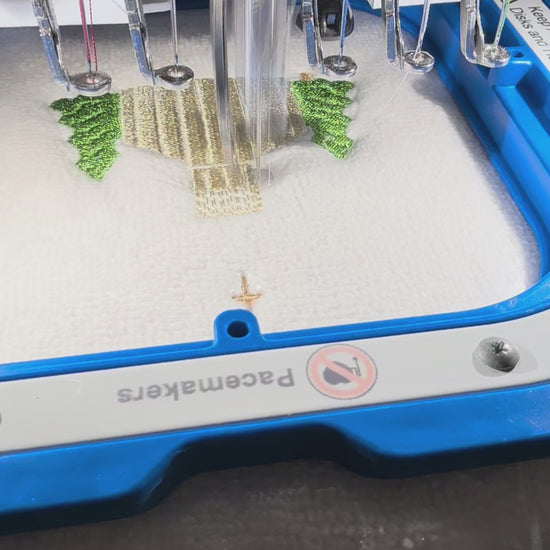 Video showing stitch detail and scale of a mini Christmas church embroidery design