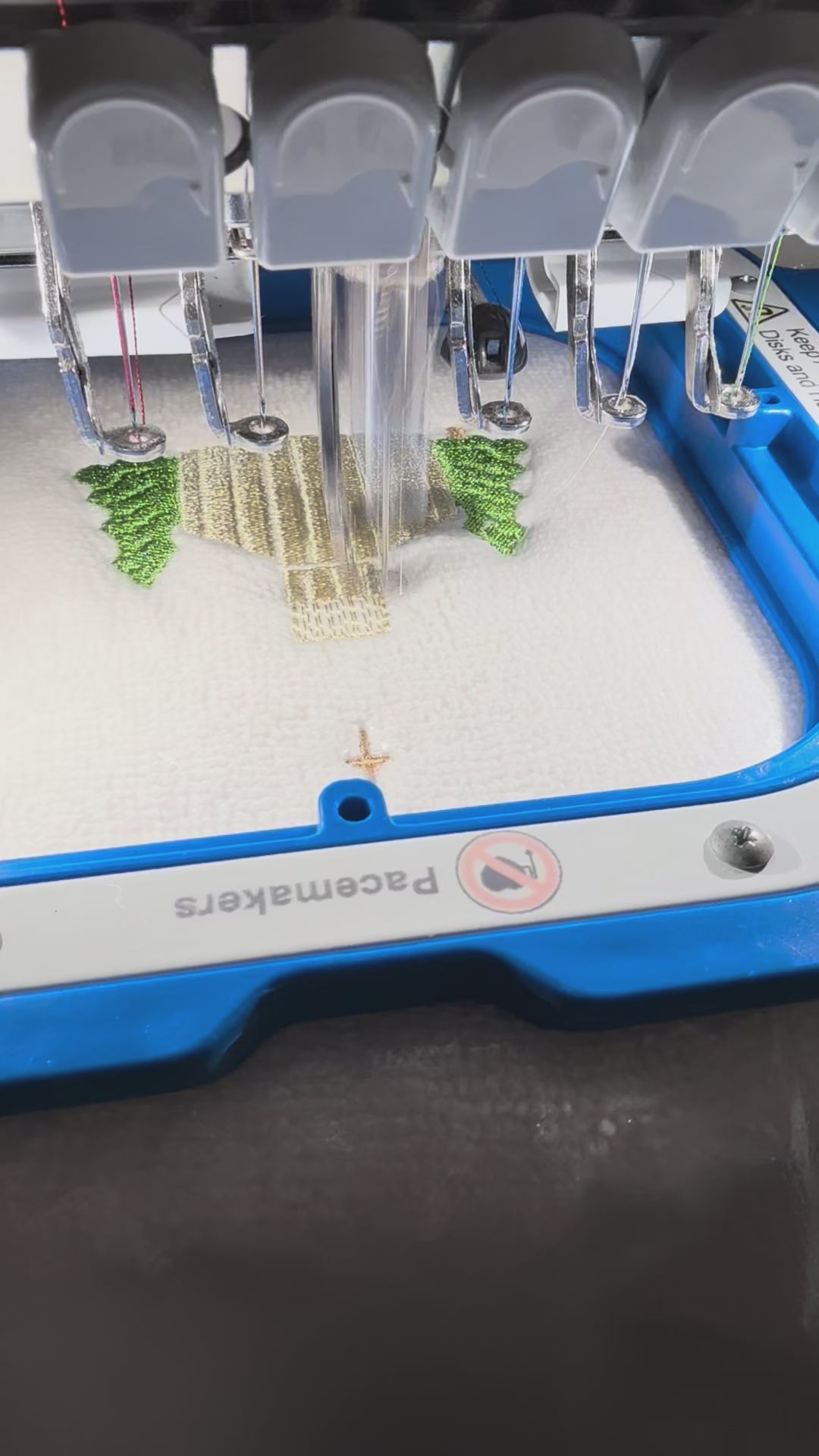 Video showing stitch detail and scale of a mini Christmas church embroidery design