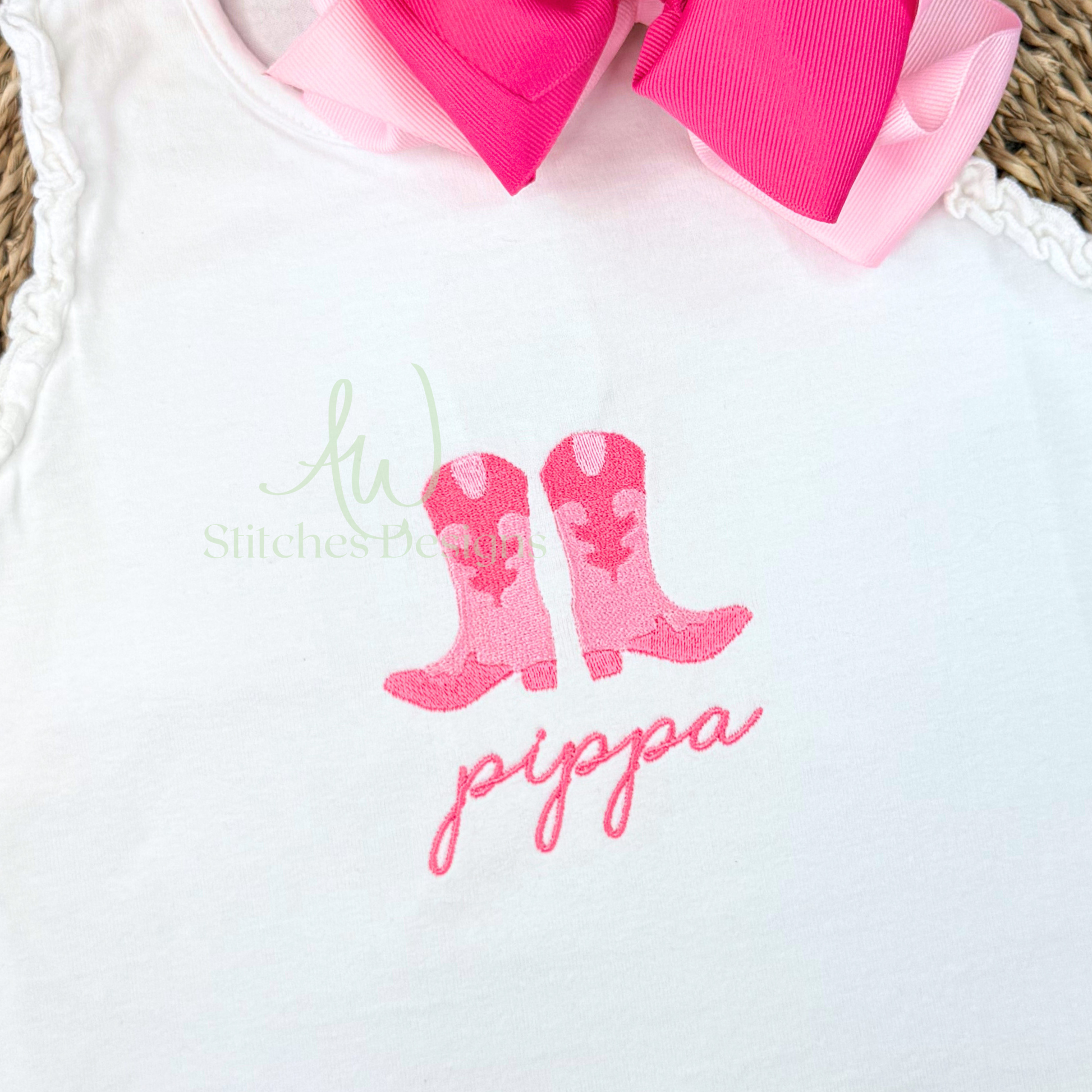 White shirt with pink rain boots and 'pippa' text on a white background